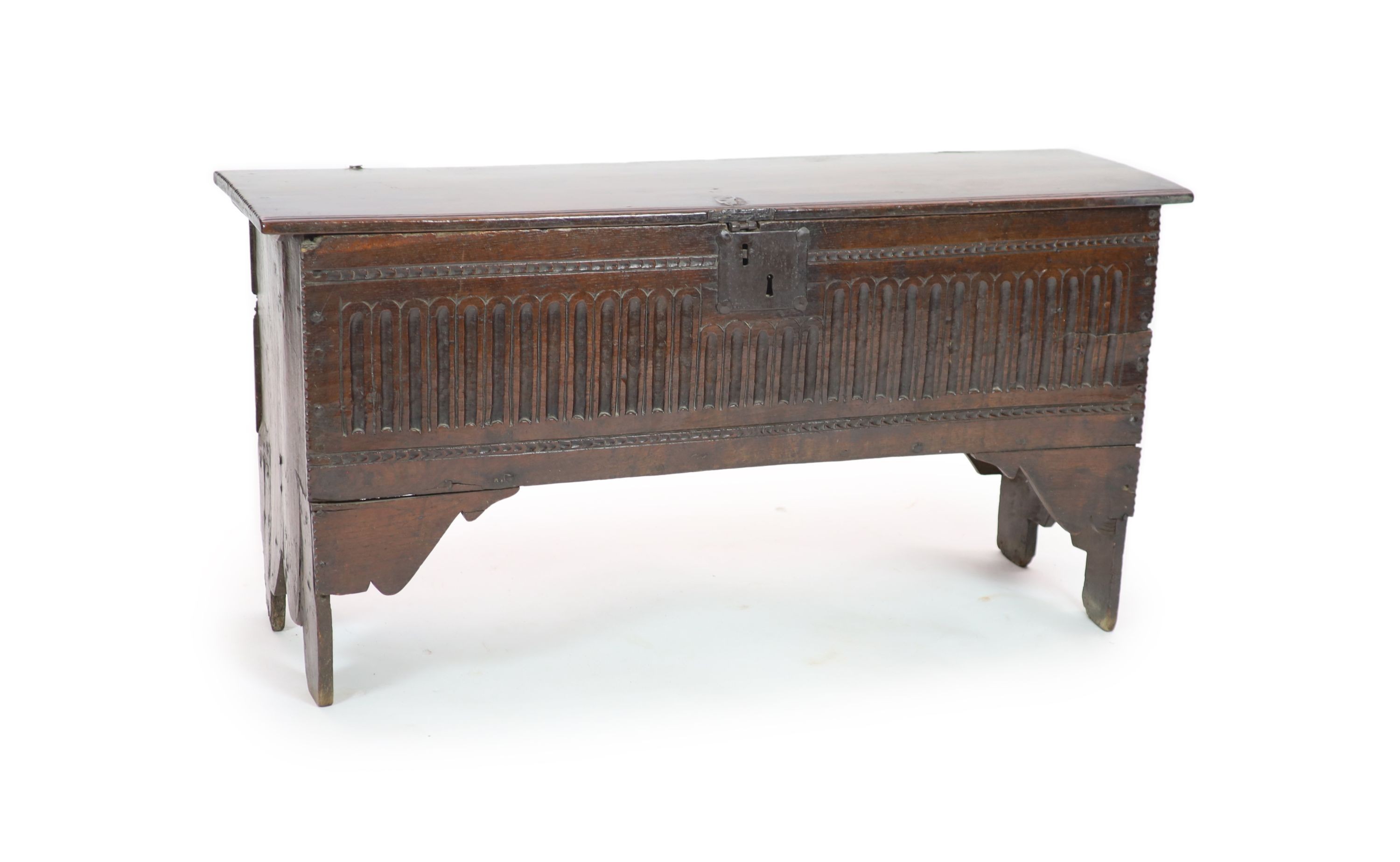 A 17th century oak six-plank chest H 64cm. W 124cm. D 38cm.